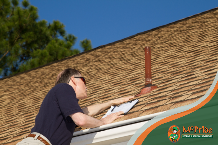 roofer in claremore inspecting roof damage to be repaired